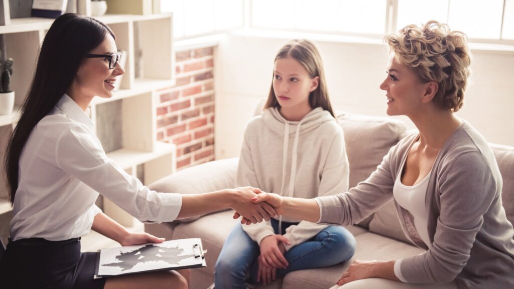 A mother supports her daughter during an appointment at an adolescent psychiatry in Raleigh.