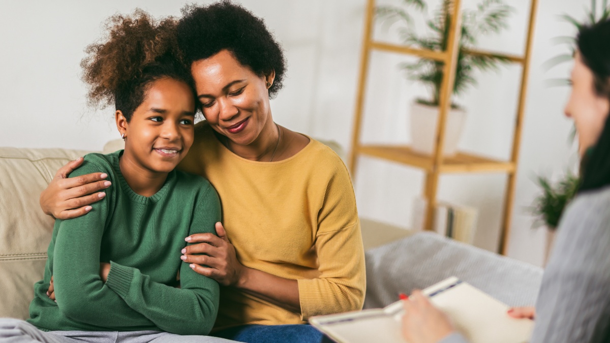 A mother and her daughter enjoy therapy together.