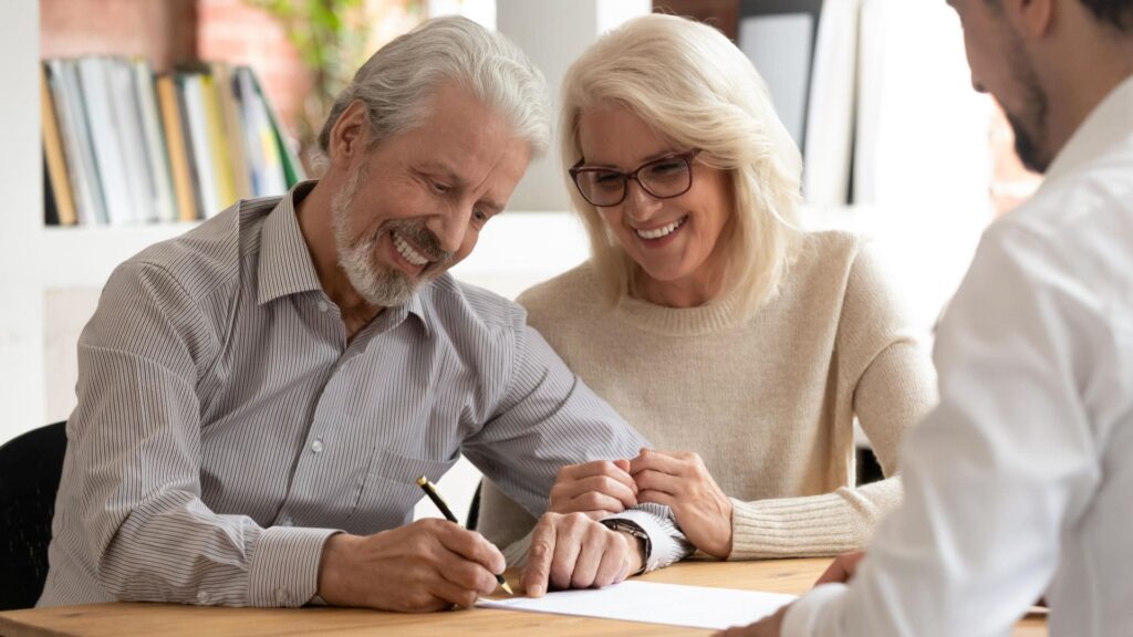 Couple reviewing documents at a Medicare psychiatry in Raleigh, NC.