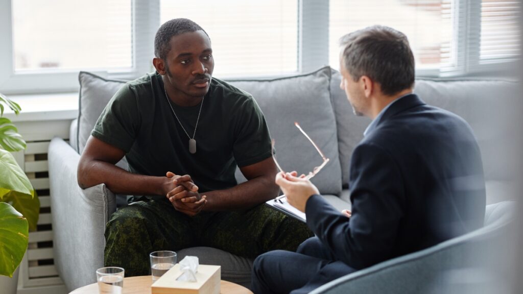 A man shares his experiences with a veteran psychiatrist in raleigh nc during an individual treatment session.