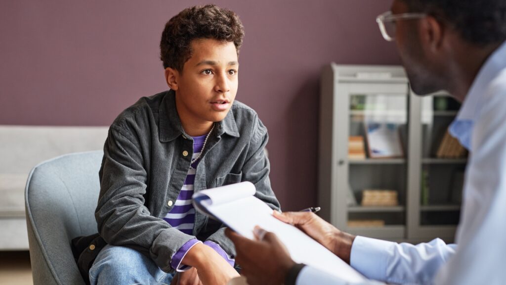 A young man shares his struggle with adhd in school during Teen ADHD treatment in Raleigh, NC