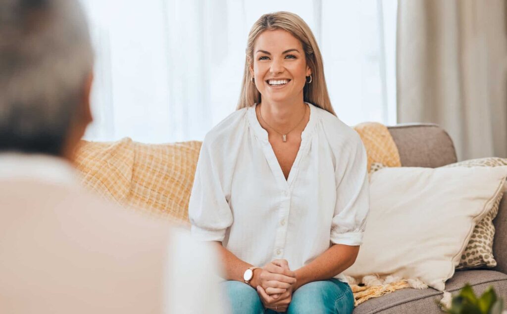 Woman feeling positive at caregiver psychiatry in Raleigh.