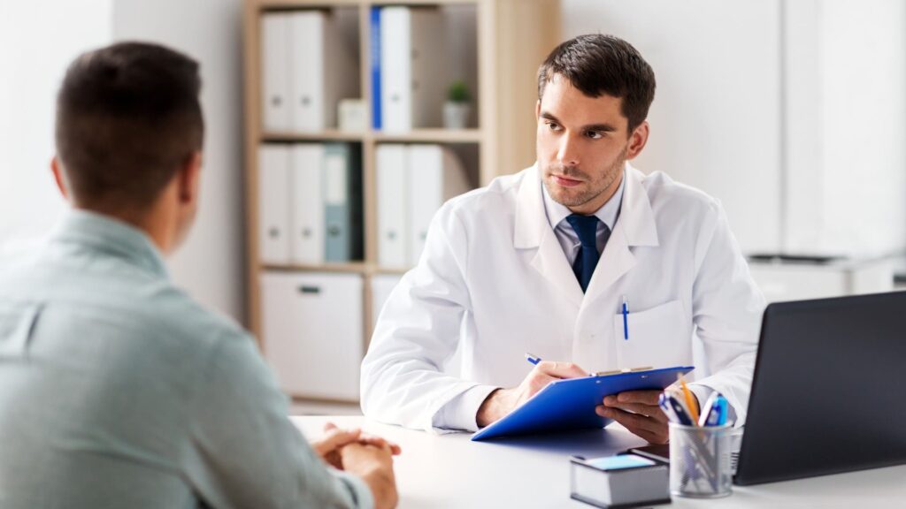 Man speaking with a psychiatrist during a follow-up at Magellan psychiatry.