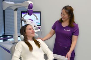 Clinician supporting a young patient during a mental health treatment session.